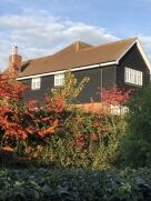 Premium black feather edge cladding on house